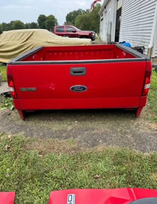 2005-2008 Ford F-150 Short Bed with tailgate and rear taillights 

rust free and has no damage or scratches or dents on it
